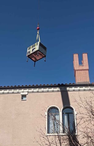AC installation crane lift to roof of large Denver home