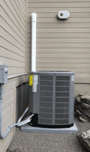 A new outdoor air conditioner condenser unit installed by Dalco Heating & Air Conditioning in Denver